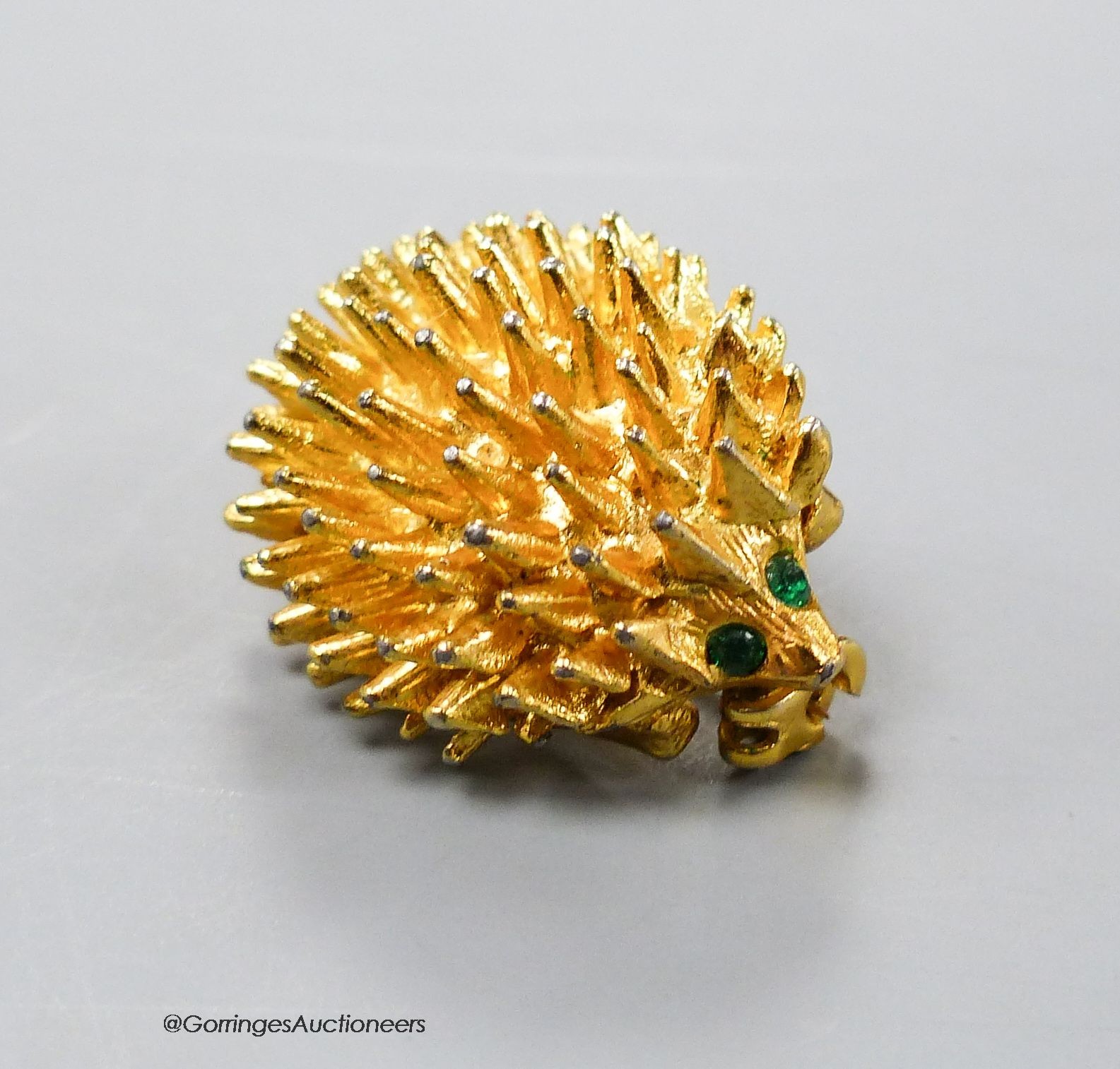 A gilt metal and paste set hedgehog brooch, 24mm.